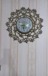یک عدد ساعت برنز دیواری