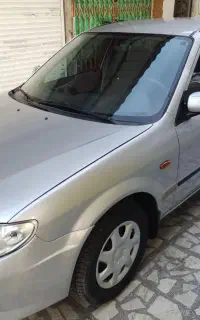 مزدا ۳۲۳ نقره آیی ۱۳۸۶ بدون رنگ سقف وکاپوت کاور