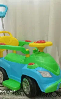 ماشین چهار چرخ دسته دار کودک فروش فوری