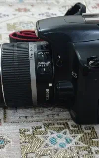 Canon 450D با لنز