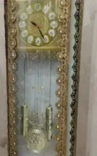 ساعت برنزایستاده