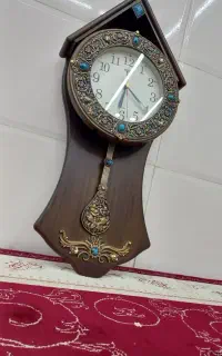 ساعت دیواری و گل و گلدون سفالی اصل