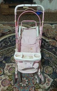 کالسکه دخترانه رنگ صورتی