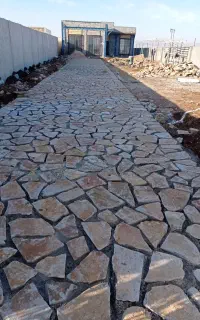 محوطه سازی اجرای سنگ فرش و جدول