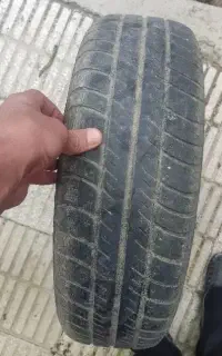 یک عدد لاستیک ۵۰ درصد و رینگ تیبا باد شده اماده