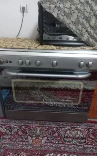 اجاق گاز تمام استیل فر دار و یک دست مبل ۹ نفره