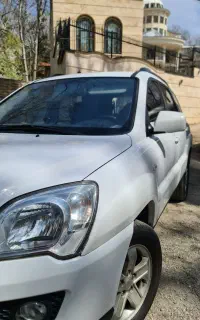 اسپورتیج سفید ۲۰۱۰ بسیار سالم بیرنگ فابریک