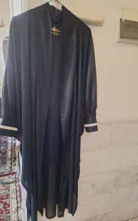 یک عددلباس مجلسی موزی ویک چادرجلوبسته ومانتومجلسی