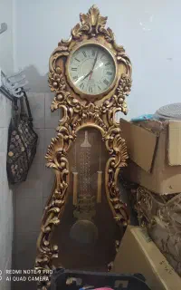 ساعت ایستاده طلایی و اینه طاووس طلایی