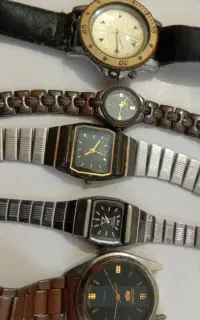 فروش تعدادی ساعت و سکه و سنگ قدیمی،