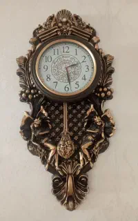 ساعت دیواری آونگ دار