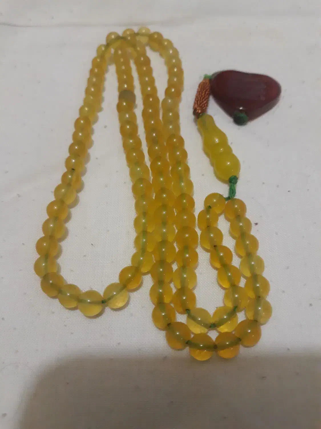 تسبیح شاه مقصود زرد قدیمی وخوش دست|کلکسیون اشیاء عتیقه|ملارد, |دیوار