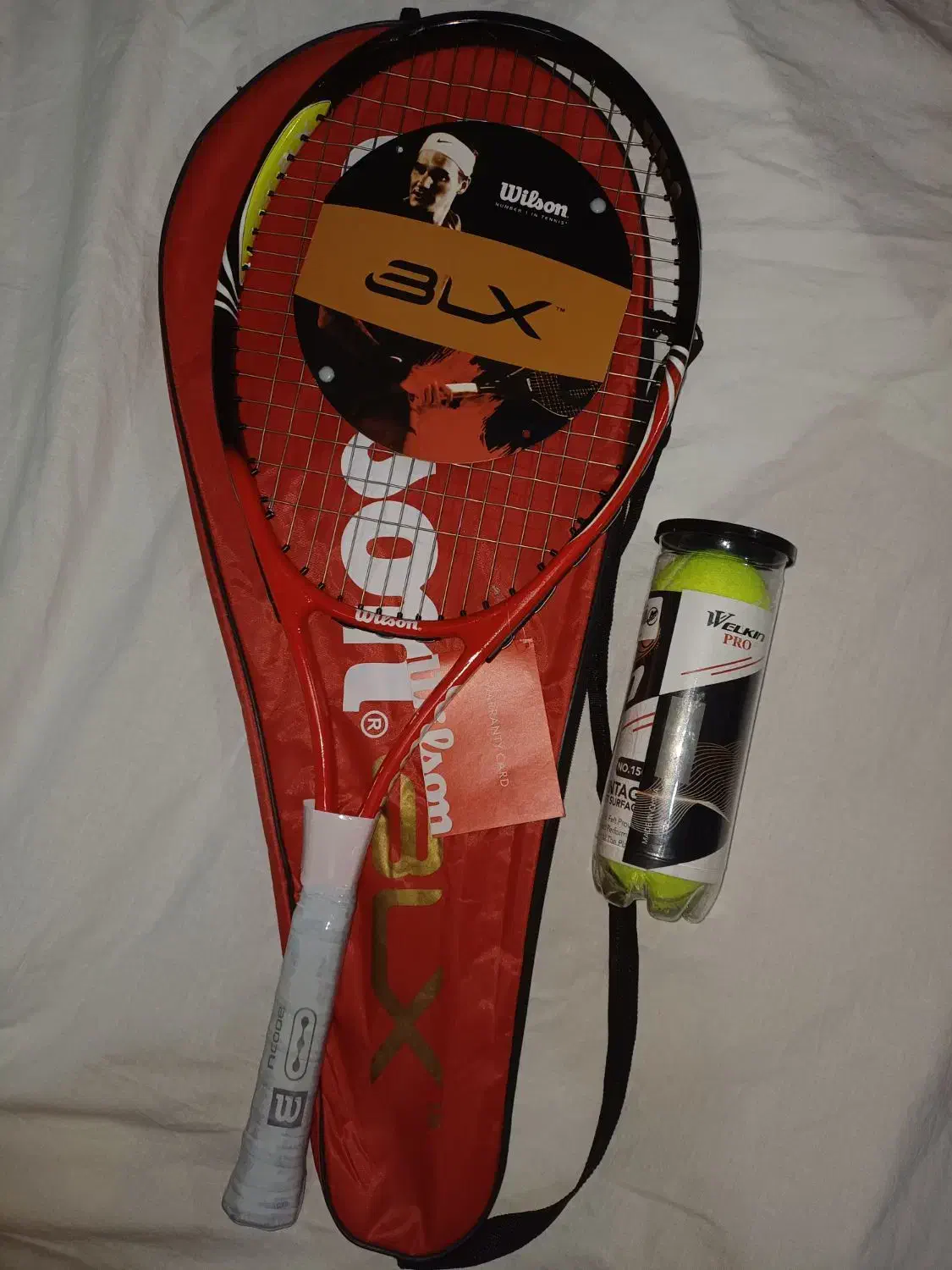 راکت تنیس ویلسون با توپ نوی نو|ورزش‌های توپی|بابل, |دیوار