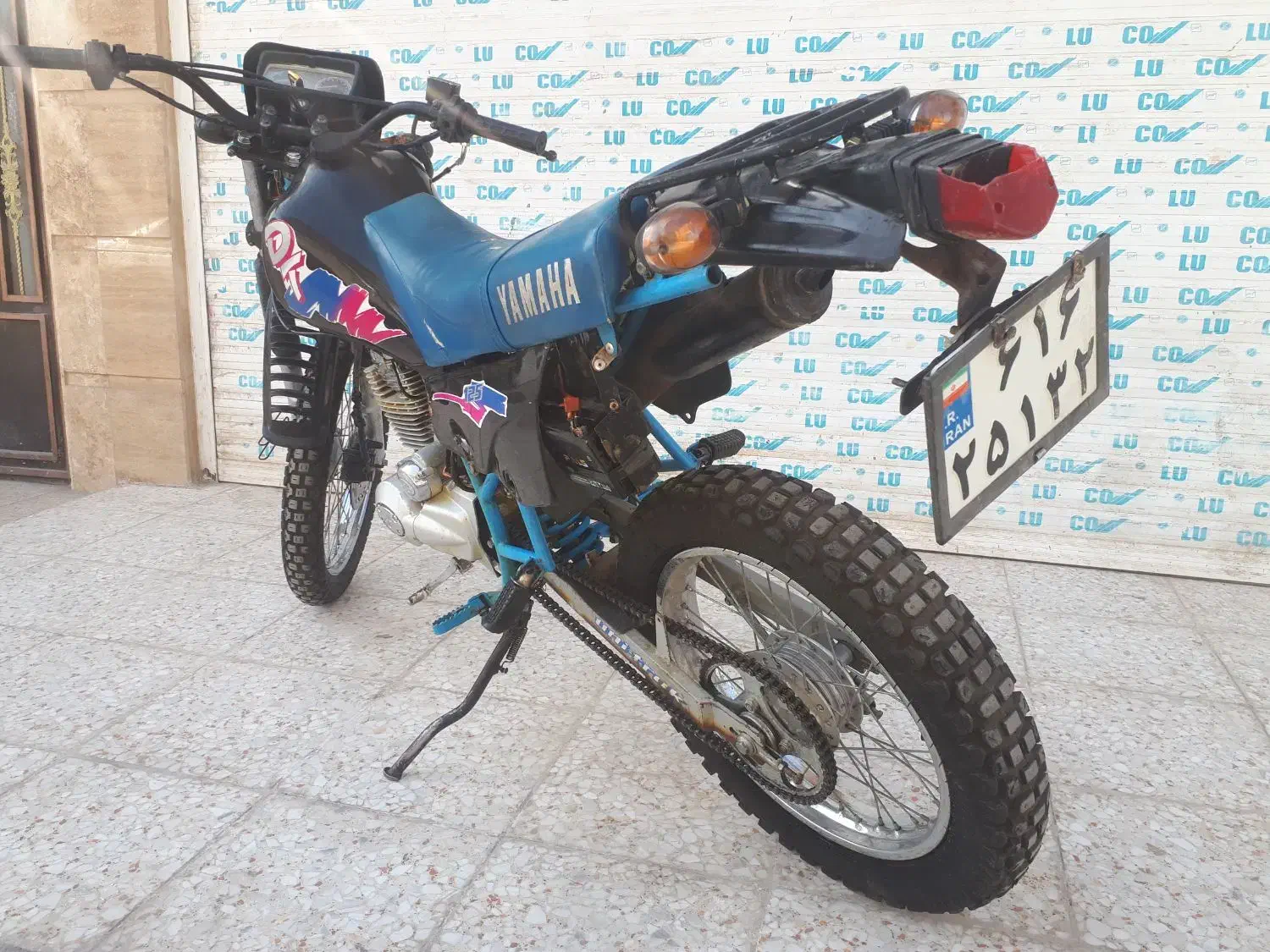 دی تی|موتورسیکلت|قم, قلعه کامکار|دیوار