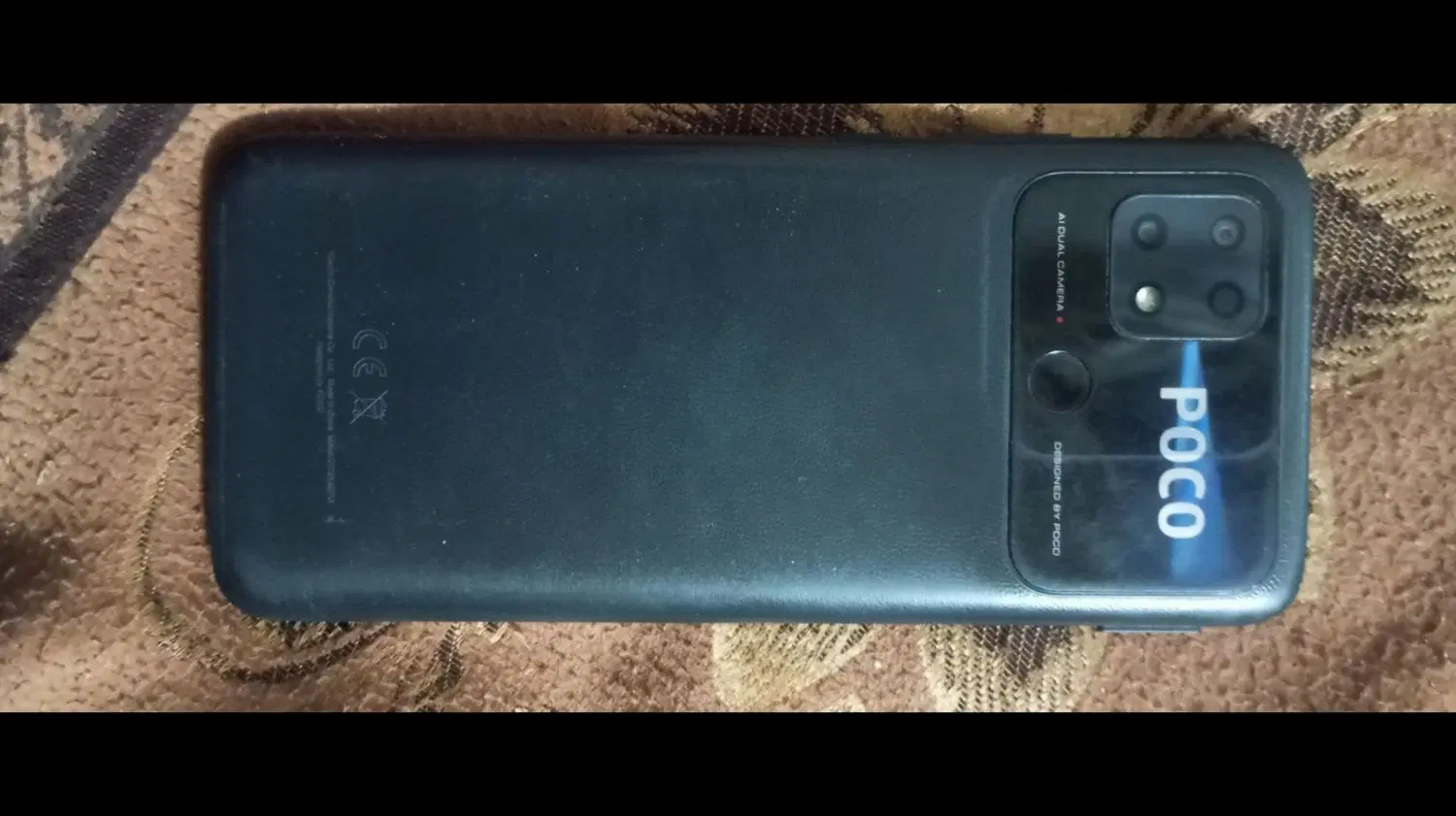 poco c40|موبایل|درمیان, |دیوار