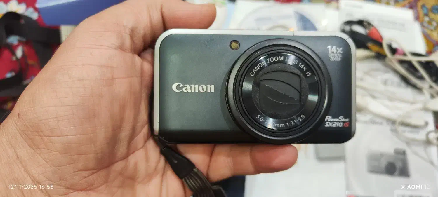 دوربین دیجیتال کنون ۱۴ مگاپیکسلی|دوربین عکاسی و فیلم‌برداری|اندیشه, اندیشه فاز ۴|دیوار