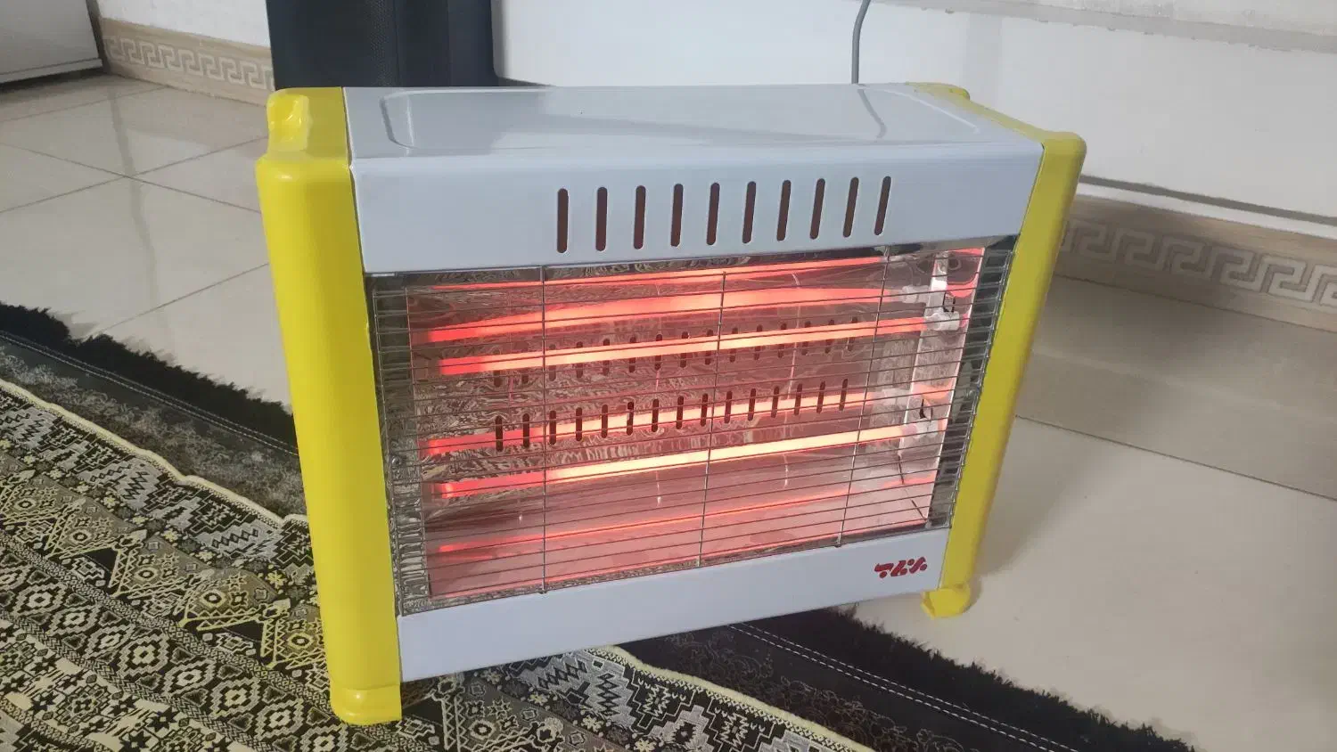 بخاری برقی در حد|بخاری، هیتر، شومینه|قم, قلعه کامکار|دیوار