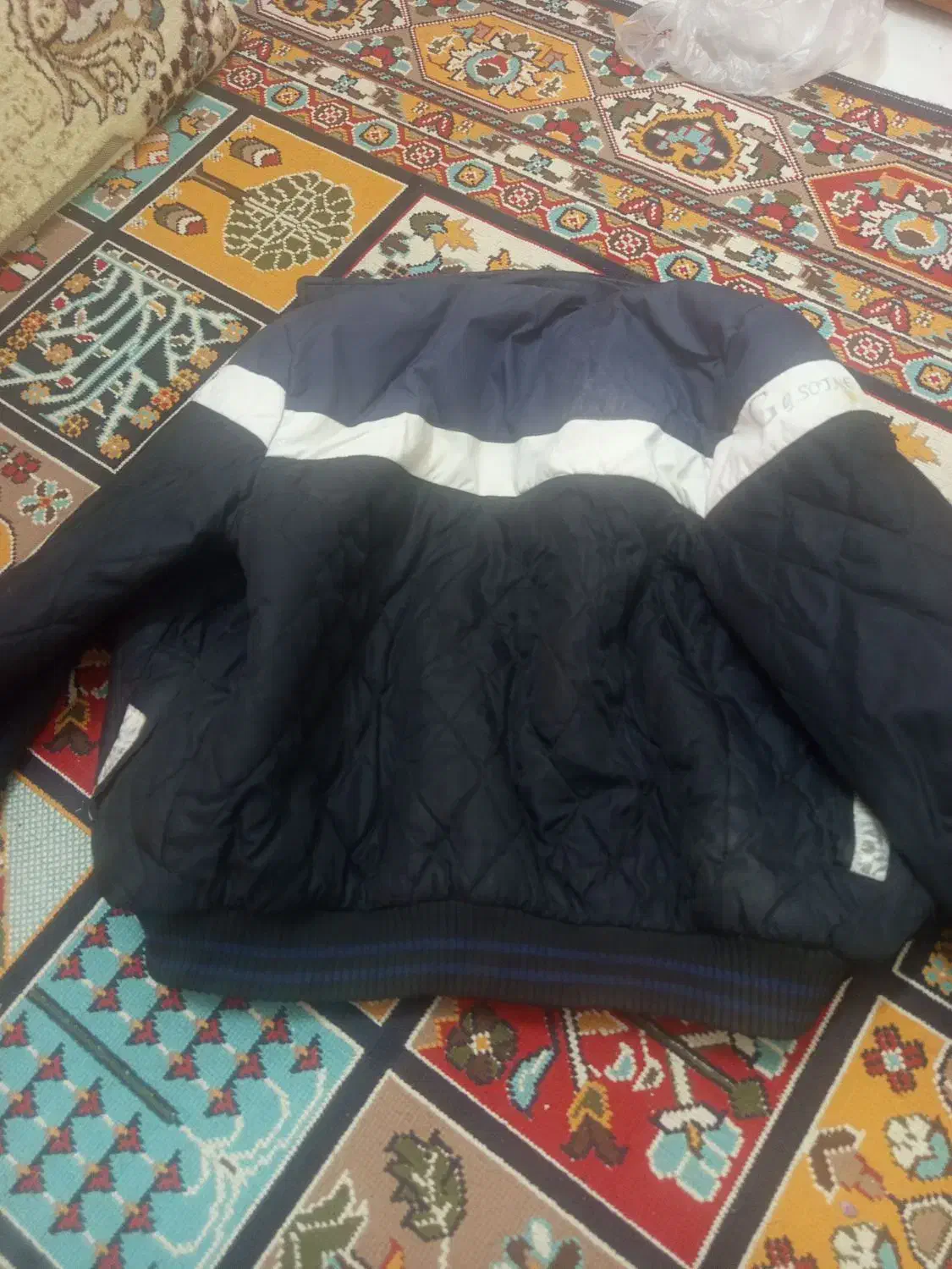 کاپشن|لباس|مشهد, طبرسی شمالی|دیوار