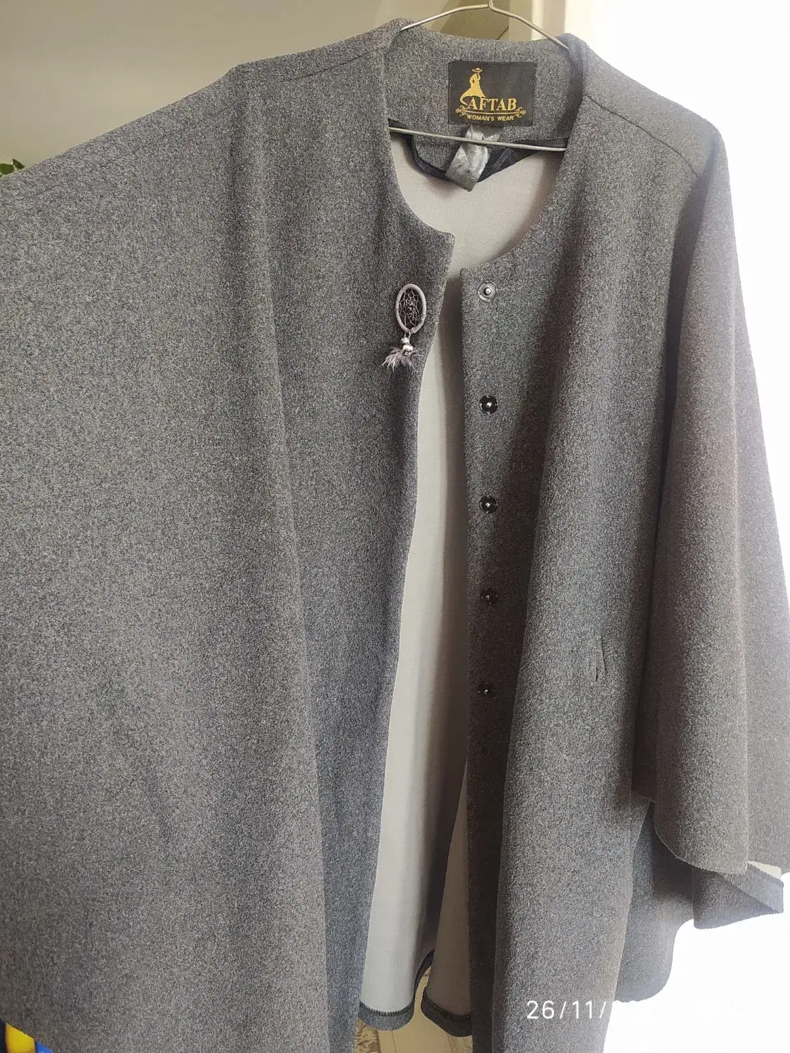 پالتو پانچو|لباس|هشتگرد, شهرک گلها|دیوار