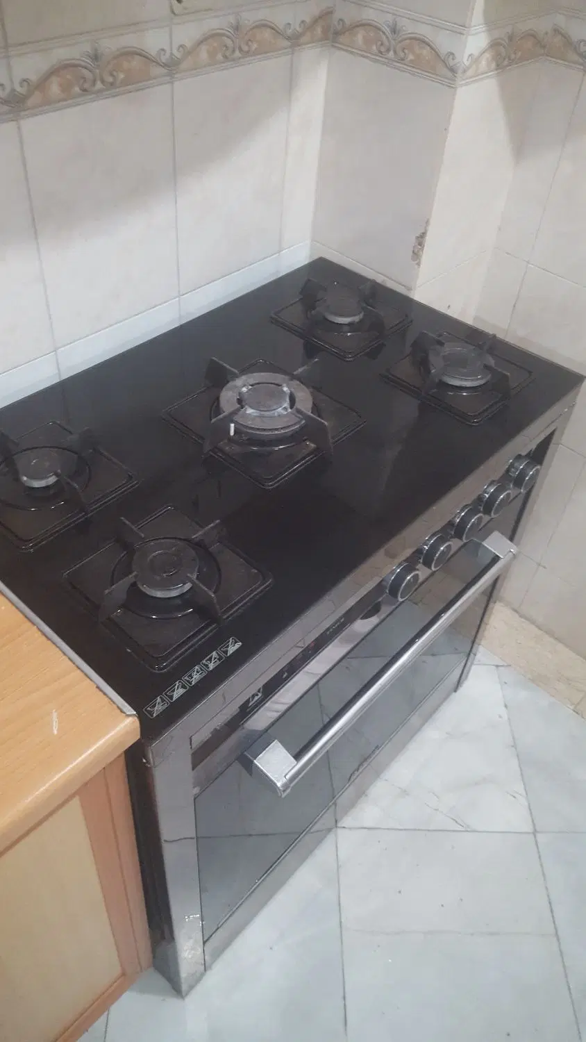 اجاق گاز 5 شعله صفحه شیشه ایی تایمر و فندک دار|اجاق گاز و لوازم برقی پختوپز|تهران, جنتآباد مرکزی|دیوار