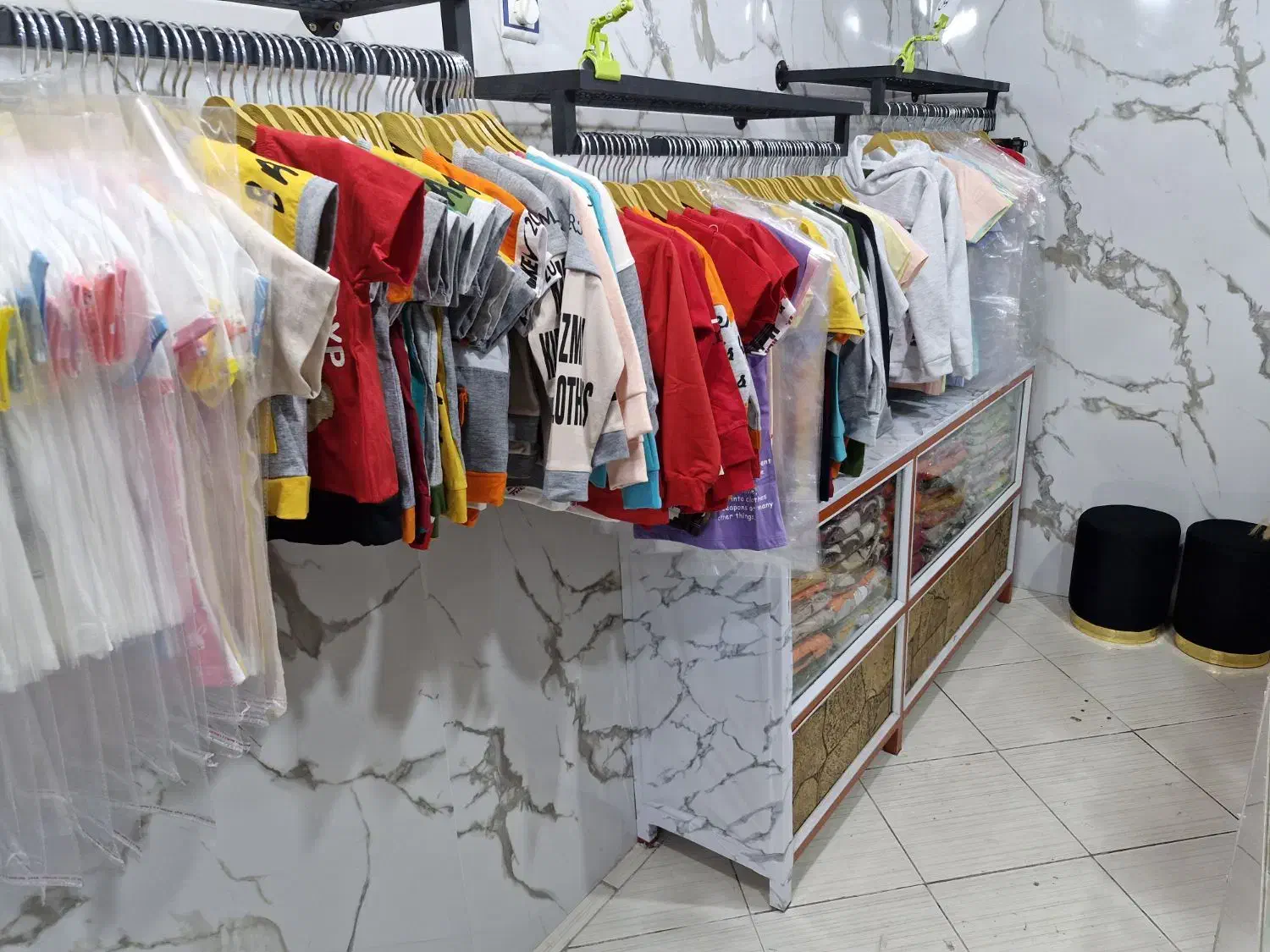 پوشاک بچه گانه|کفش و لباس بچه|شیراز, لب آب|دیوار