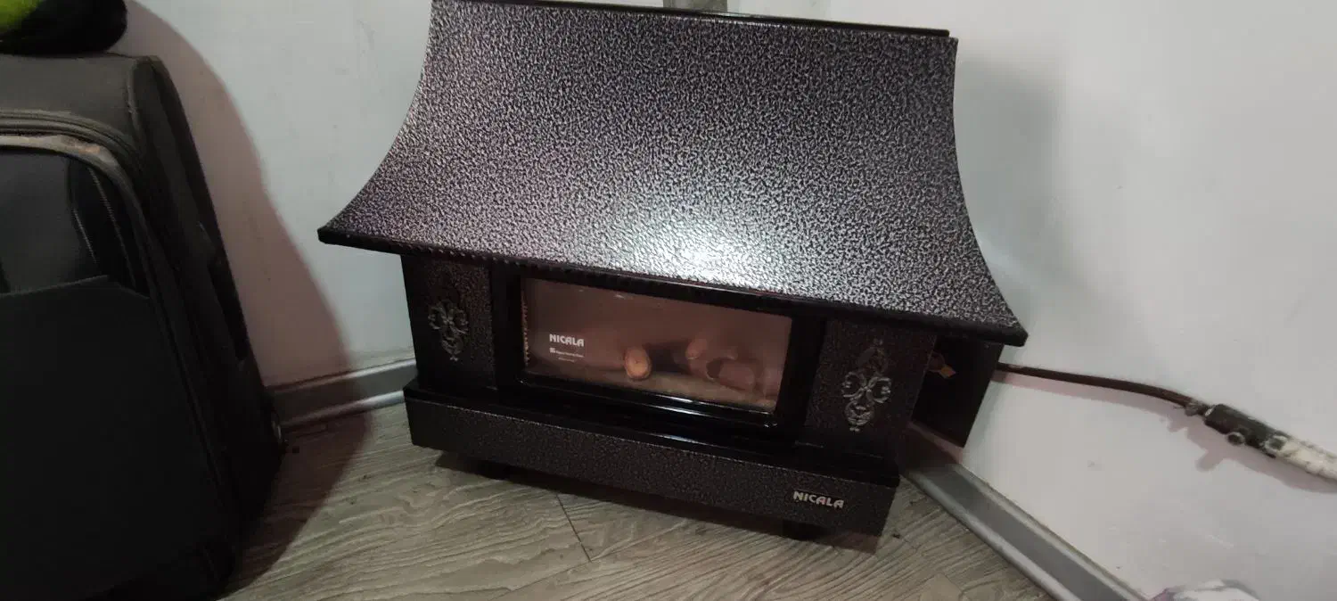 بخاری طرح شومینه نیک کالا|بخاری، هیتر، شومینه|رشت, باهنر|دیوار