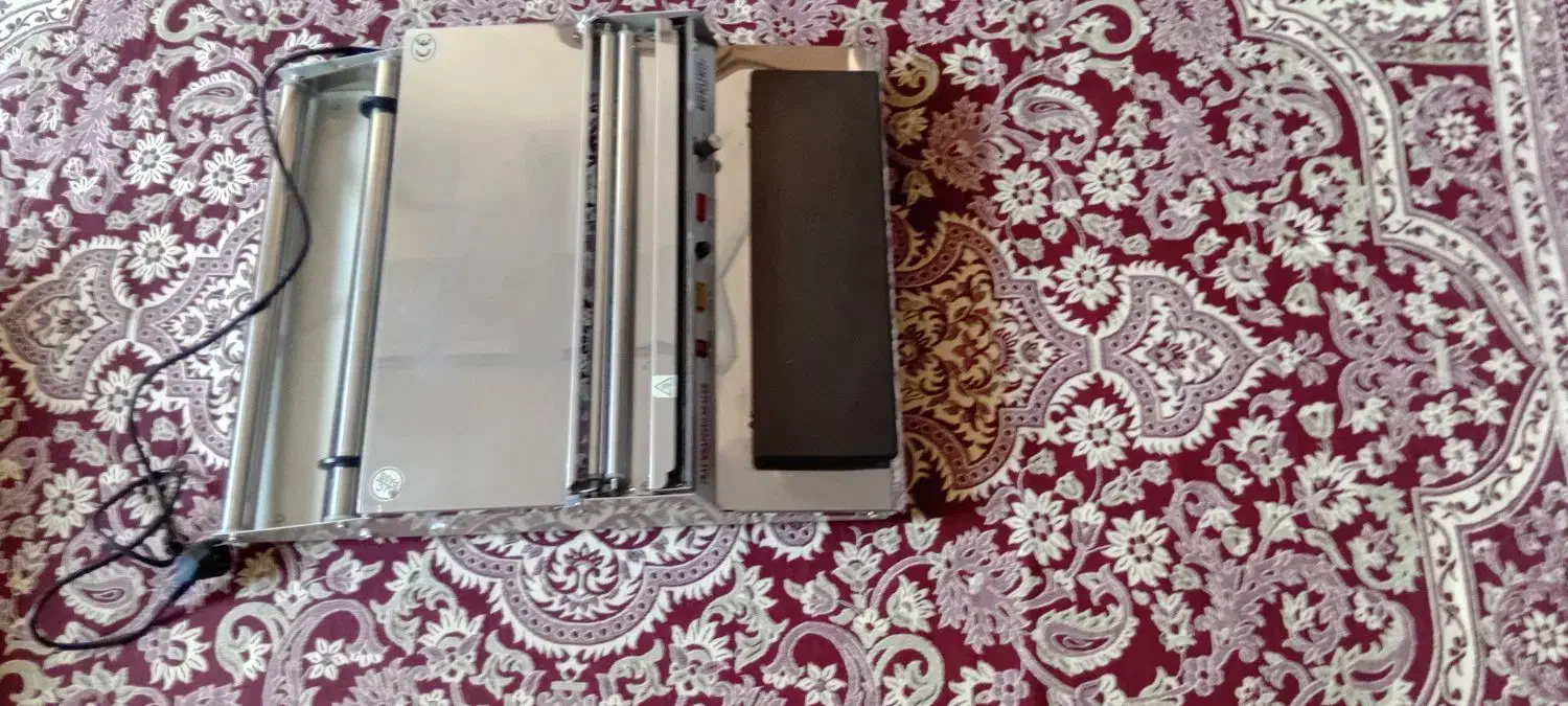 یک عدد دستگاه سلفون کش و یک عدد فن هواکش بزرگ|پنکه و تصفیهکنندهٔ هوا|تبریز, |دیوار