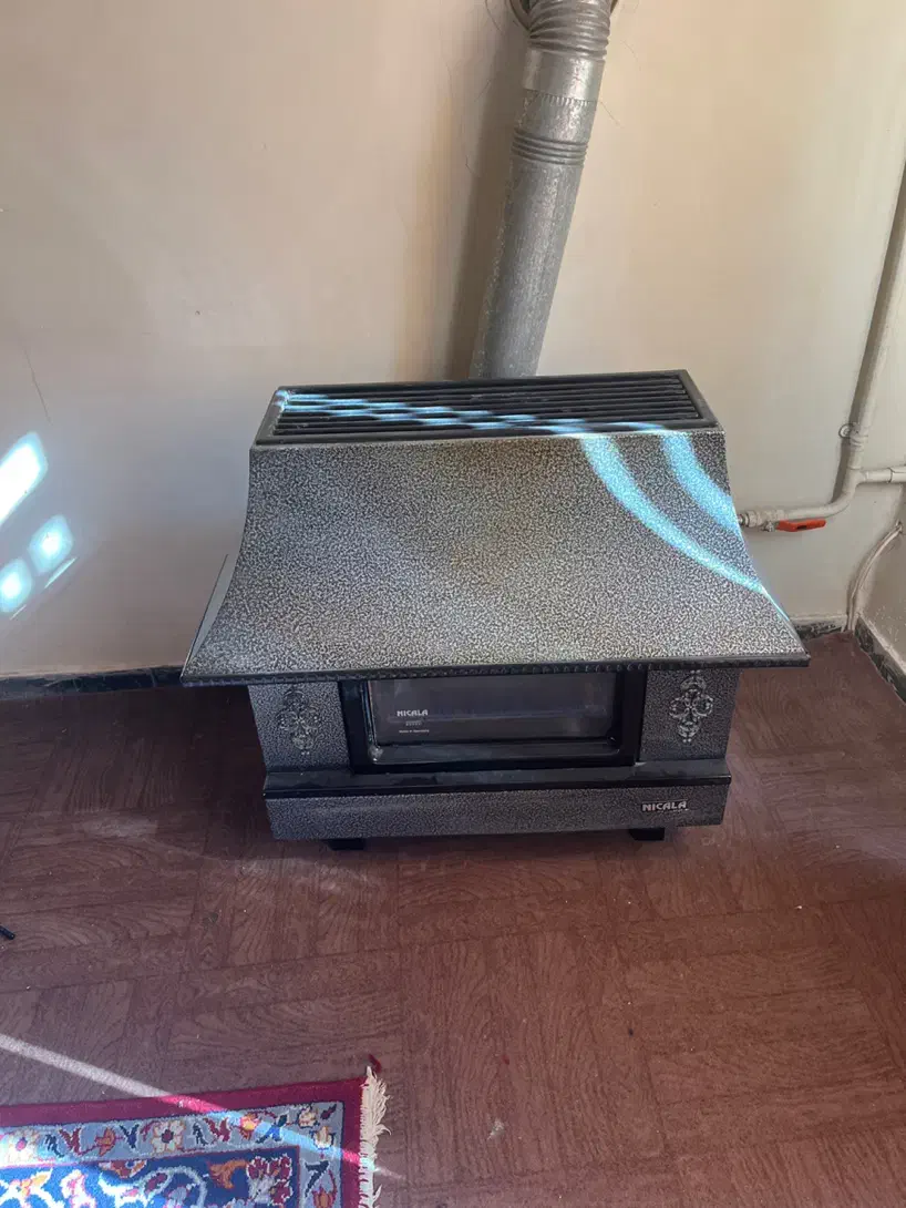 بخاری نیک کالا شومینه ای در حد نو|بخاری، هیتر، شومینه|کرمان, |دیوار