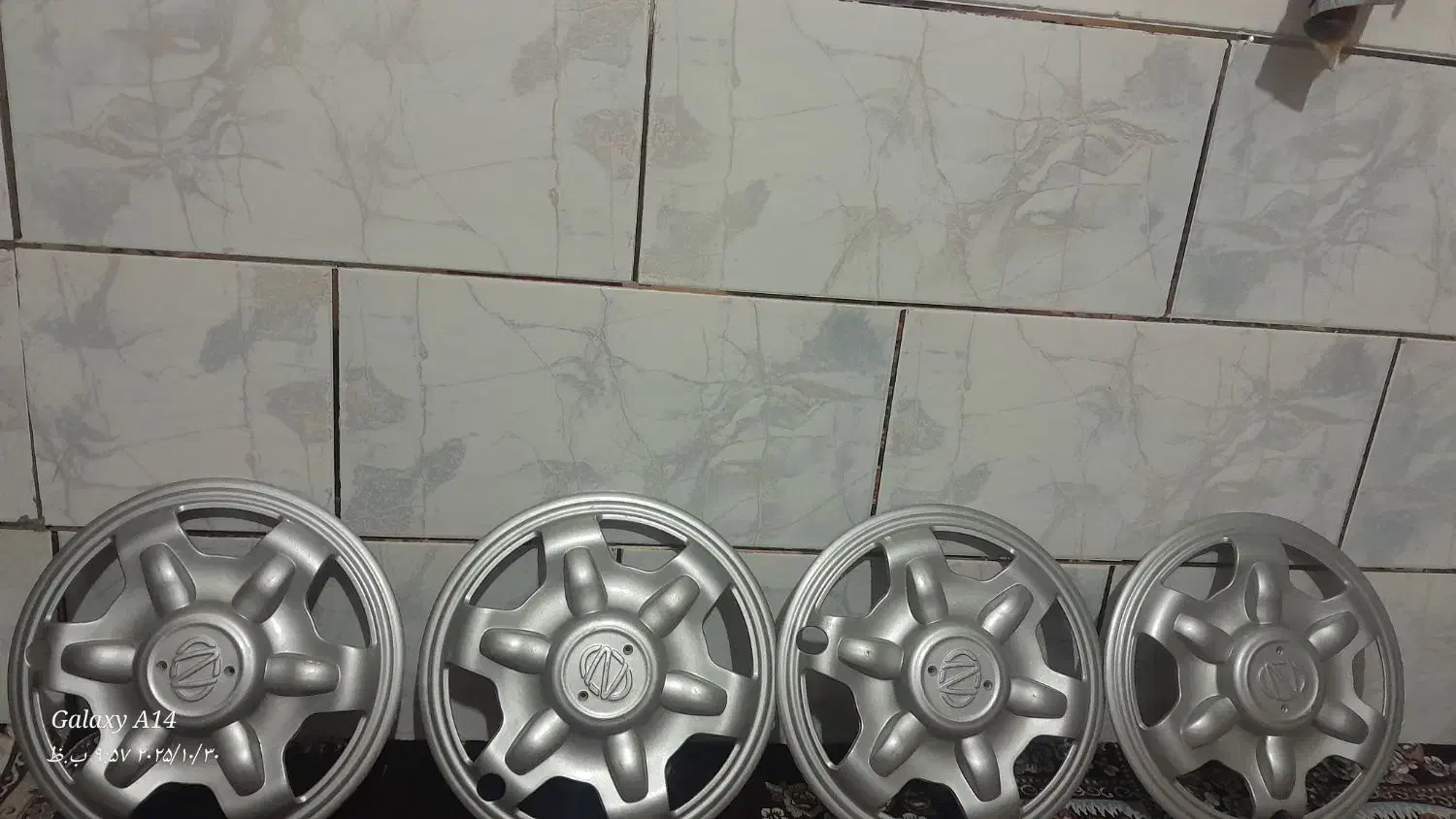 قالپاق نیسان|قطعات یدکی و لوازم جانبی|شیراز, کوشک میدان|دیوار