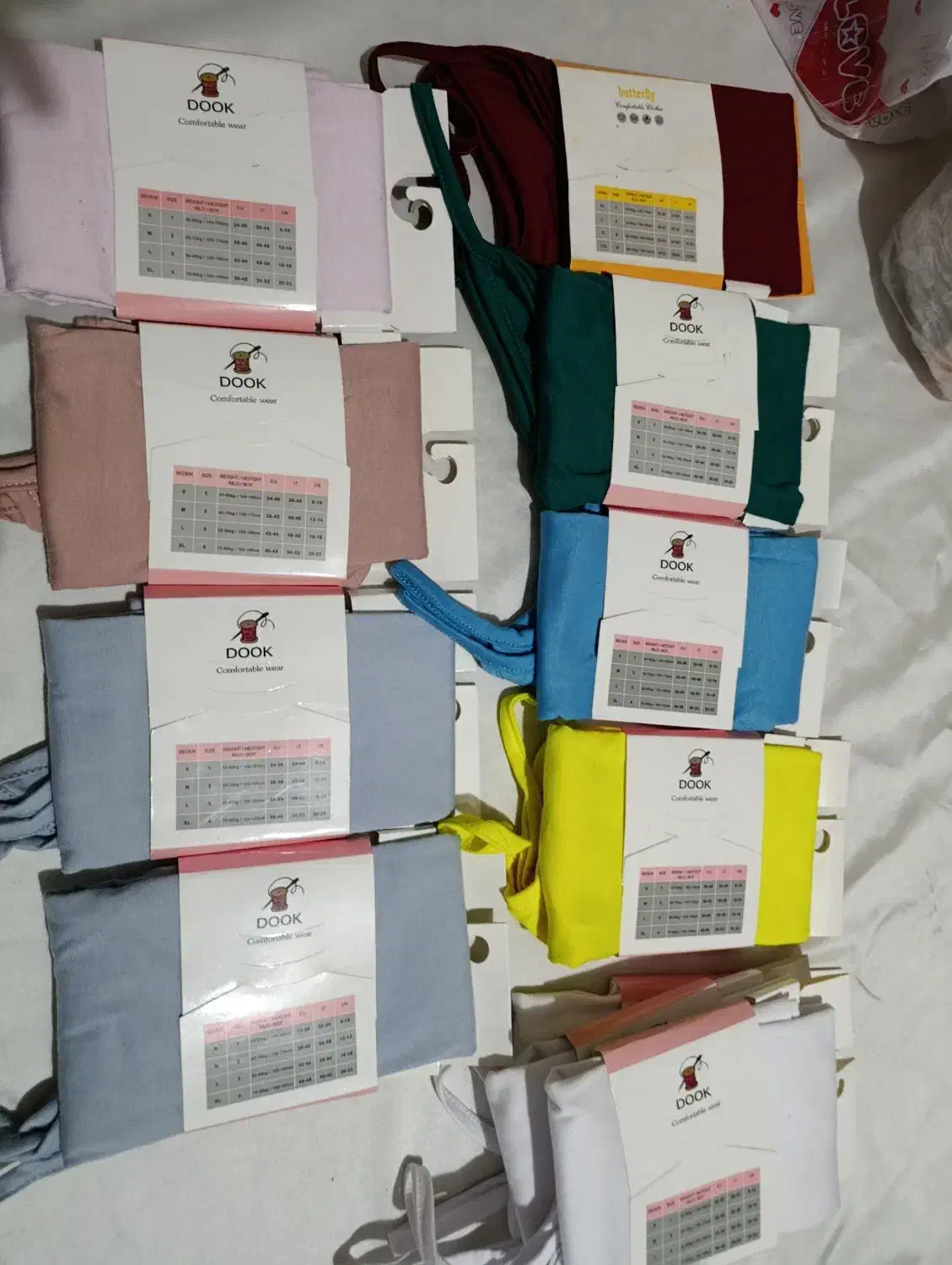 تاپ بندی برند دوک بسته بندی اصلی شرکت|لباس|قزوین, |دیوار