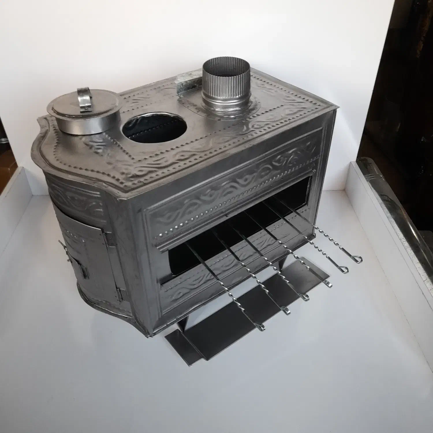 بخاری هیزمی جدید ورق طرحدار با سه کارایی|بخاری، هیتر، شومینه|اراک, |دیوار