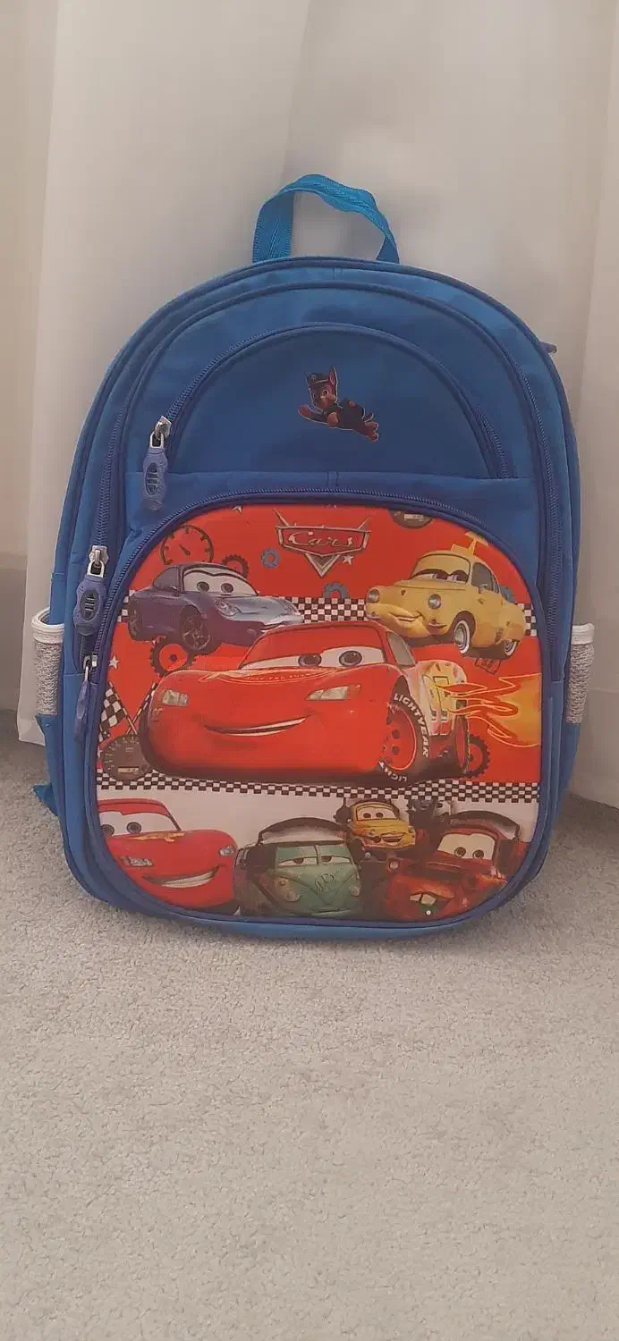 کوله مدرسه|کیف، کفش، کمربند|قم, بنیاد|دیوار