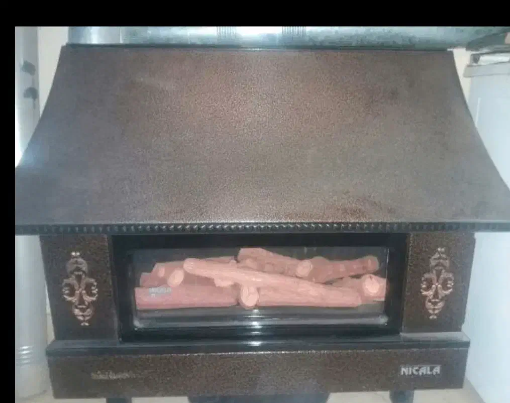 بخاری شومینه دار در حد نو و بسیار تمیز|بخاری، هیتر، شومینه|کرمان, |دیوار