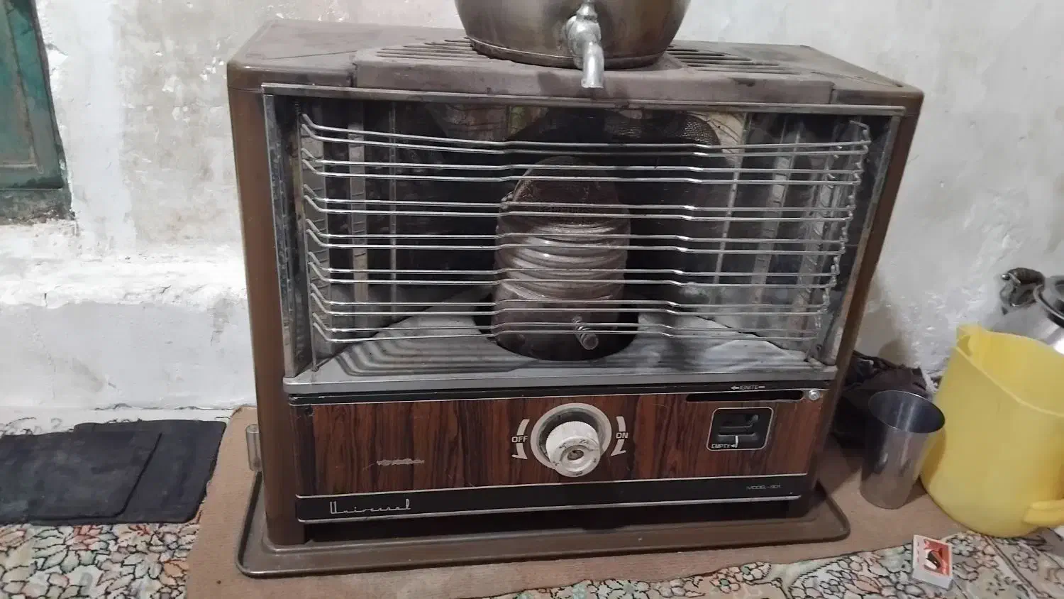 یک بخاری نفتی در برابر نو|بخاری، هیتر، شومینه|شاهرود, |دیوار