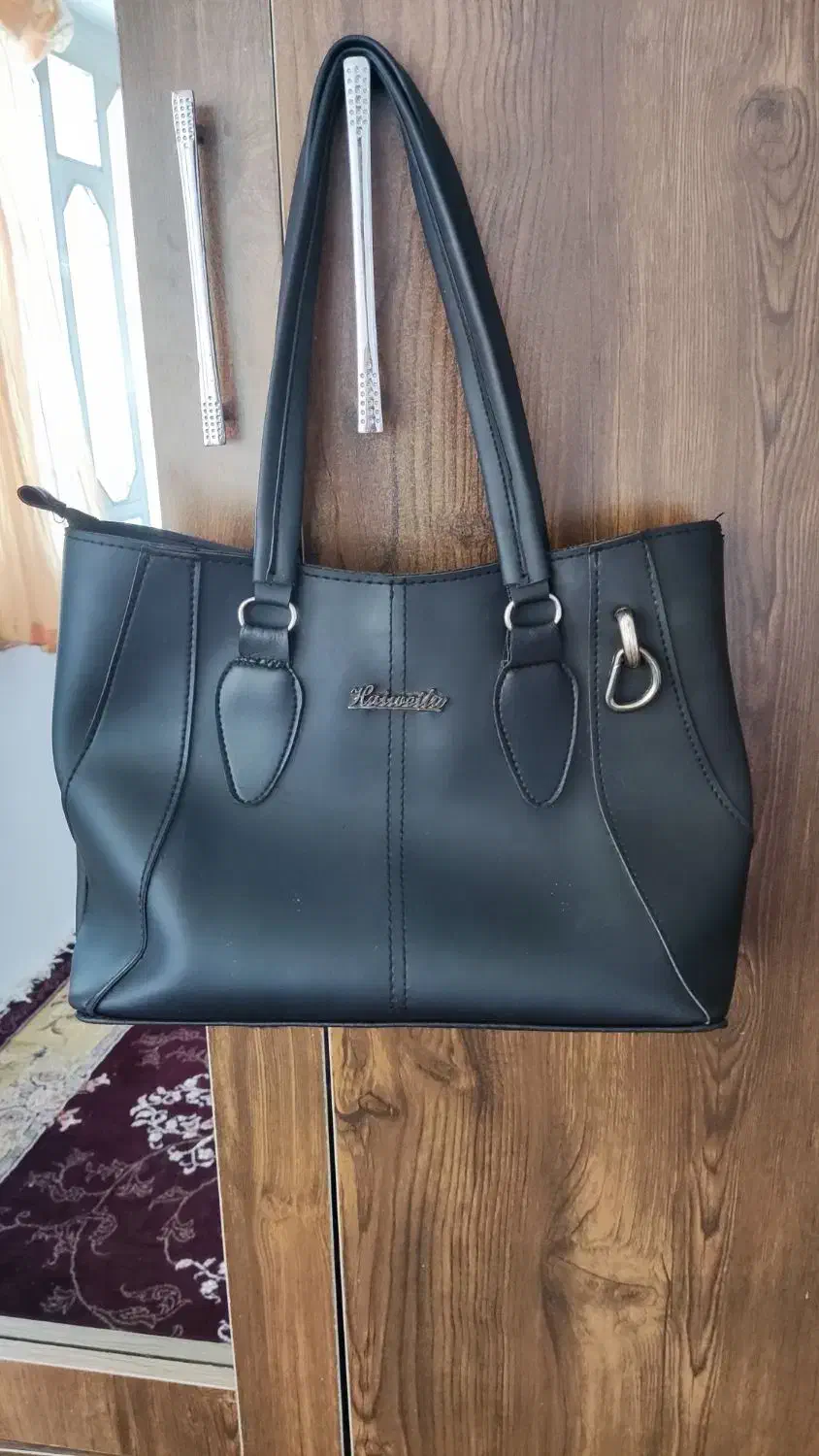 کیف|کیف، کفش، کمربند|لاهیجان, کوی زمانی|دیوار