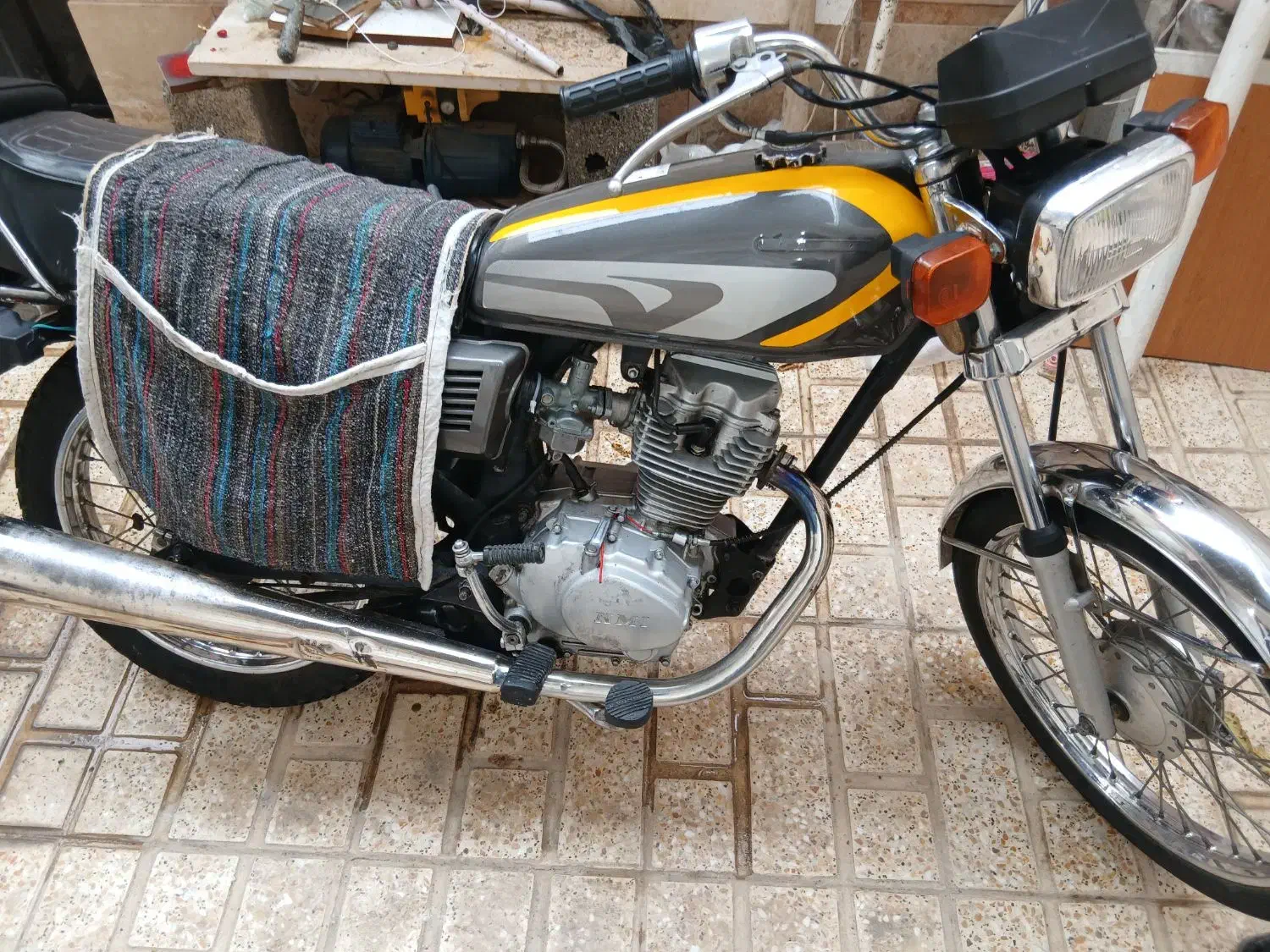 هوندا ۱۲۵ مدل ۹۰|موتورسیکلت|رباط‌کریم, کیکاور|دیوار