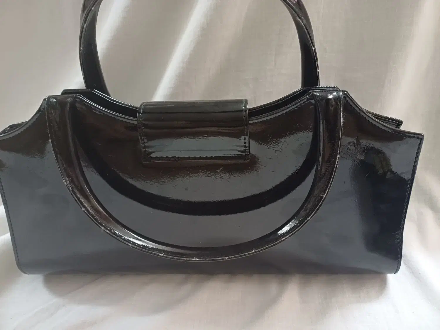 کیف مجلسی|کیف، کفش، کمربند|اصفهان, جاوان|دیوار