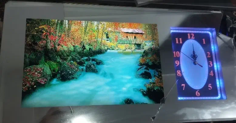 ساعت دیواری با تصویر نوری زیبا و صدای دلنشین|ساعت دیواری و تزئینی|اندیمشک, |دیوار