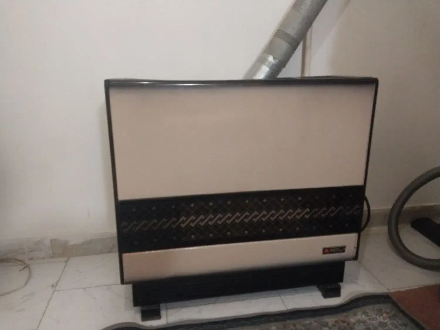 بخاری درحال استفاده سالم|بخاری، هیتر، شومینه|لاهیجان, کوی آزادگان|دیوار