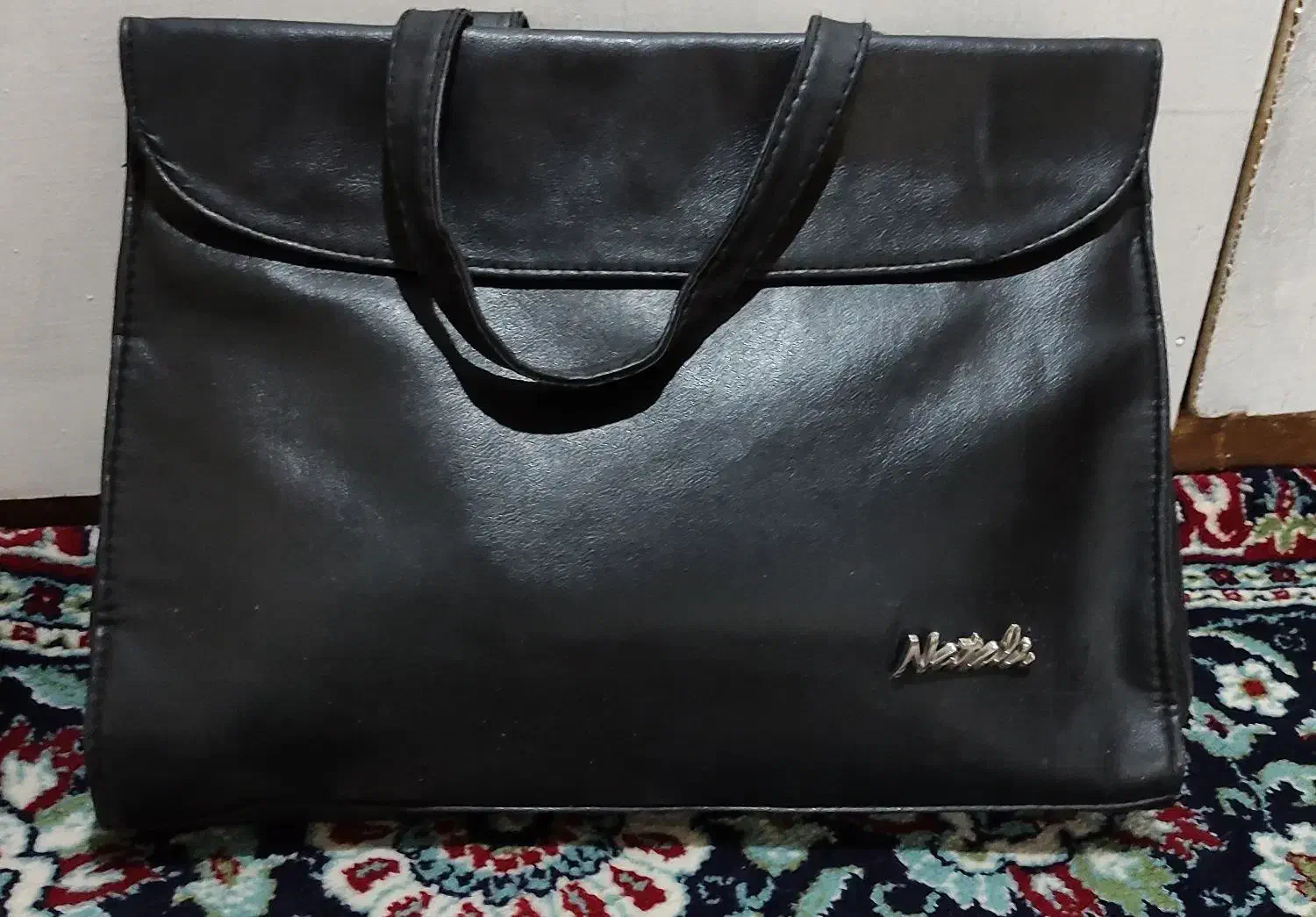 کیف|کیف، کفش، کمربند|نهاوند, |دیوار