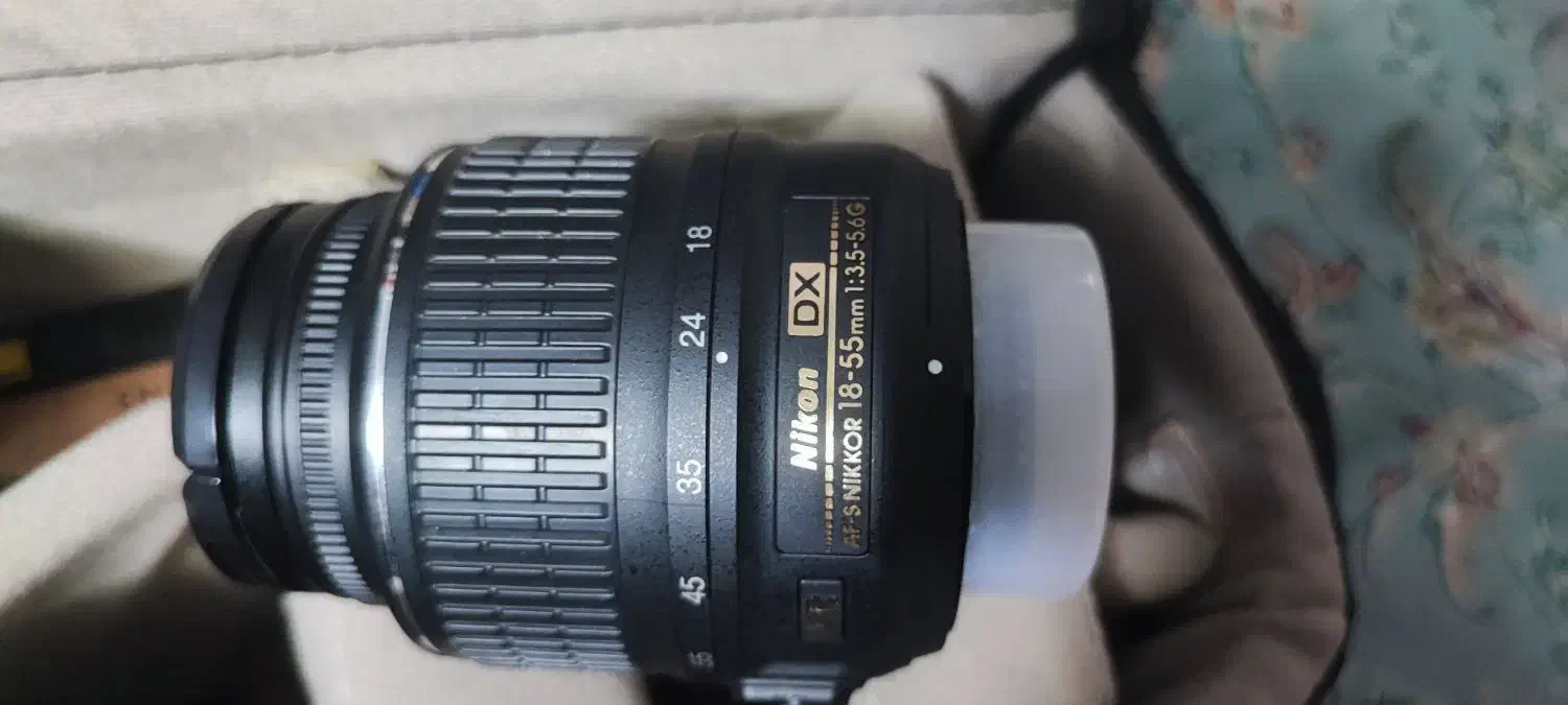 نیکون Nikon D5100 در حد نو + لنز + باتری اضافه|دوربین عکاسی و فیلم‌برداری|شیراز, شاهچراغ|دیوار