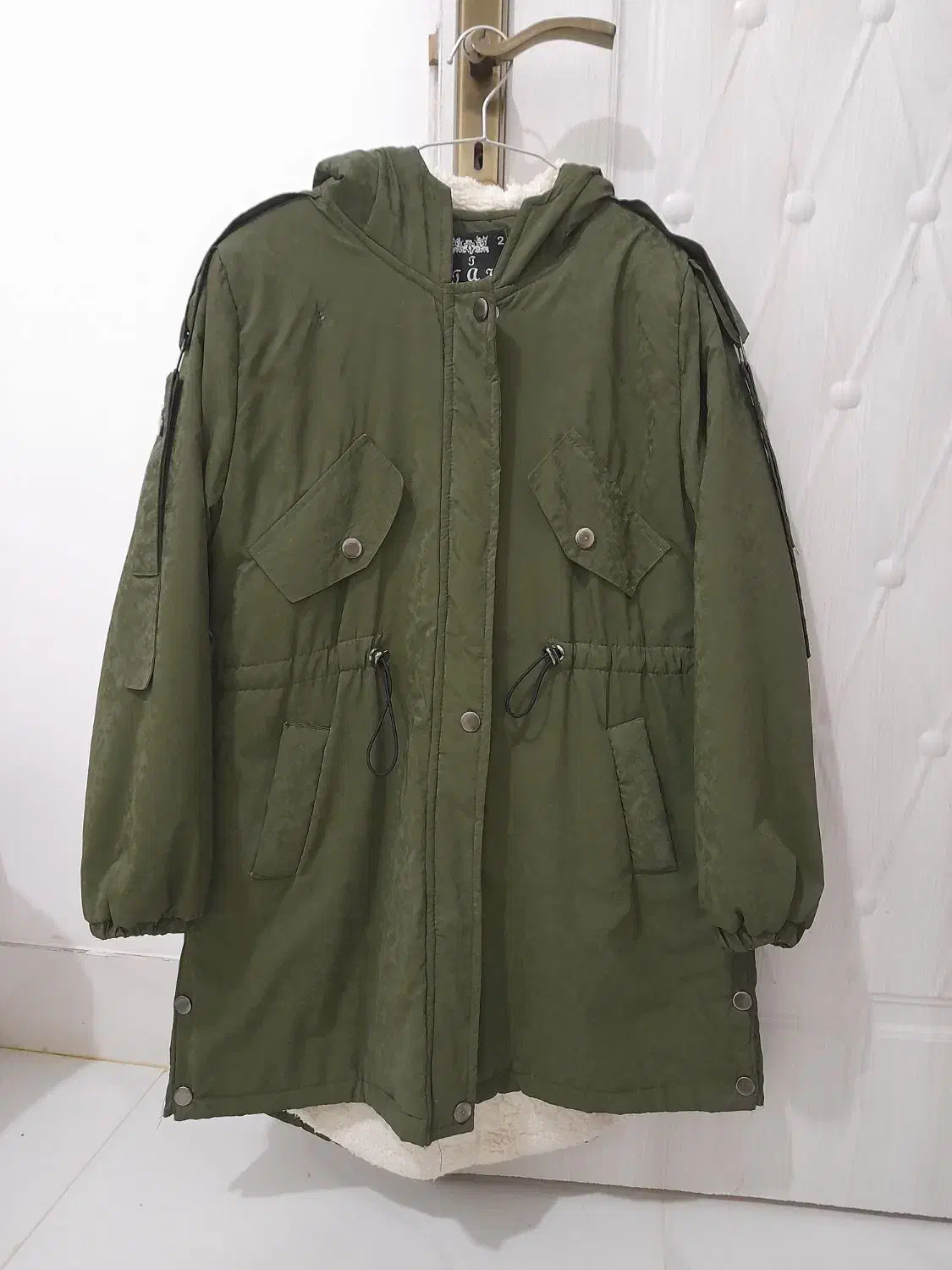 کاپشن درحد نو|لباس|تربت جام, باغ سنگان سفلی|دیوار