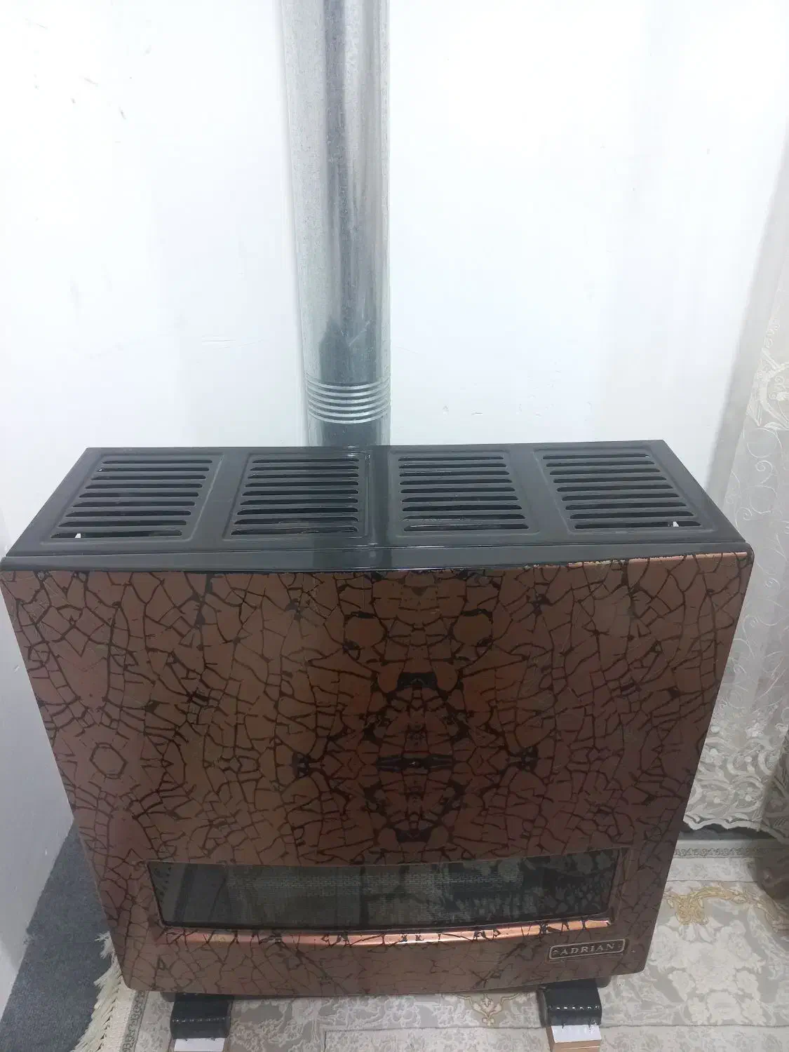 بخاری۱۲ هزار آدریان.درحد نو|بخاری، هیتر، شومینه|آستانه اشرفیه, |دیوار