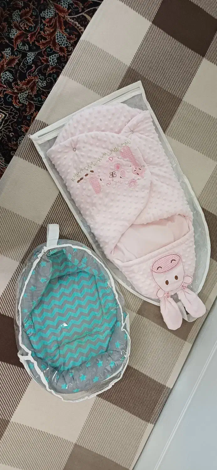 آغوشی سوئیسی نوزاد و کیسه خواب در حد نو|اسباب و اثاث بچه|اهر, |دیوار