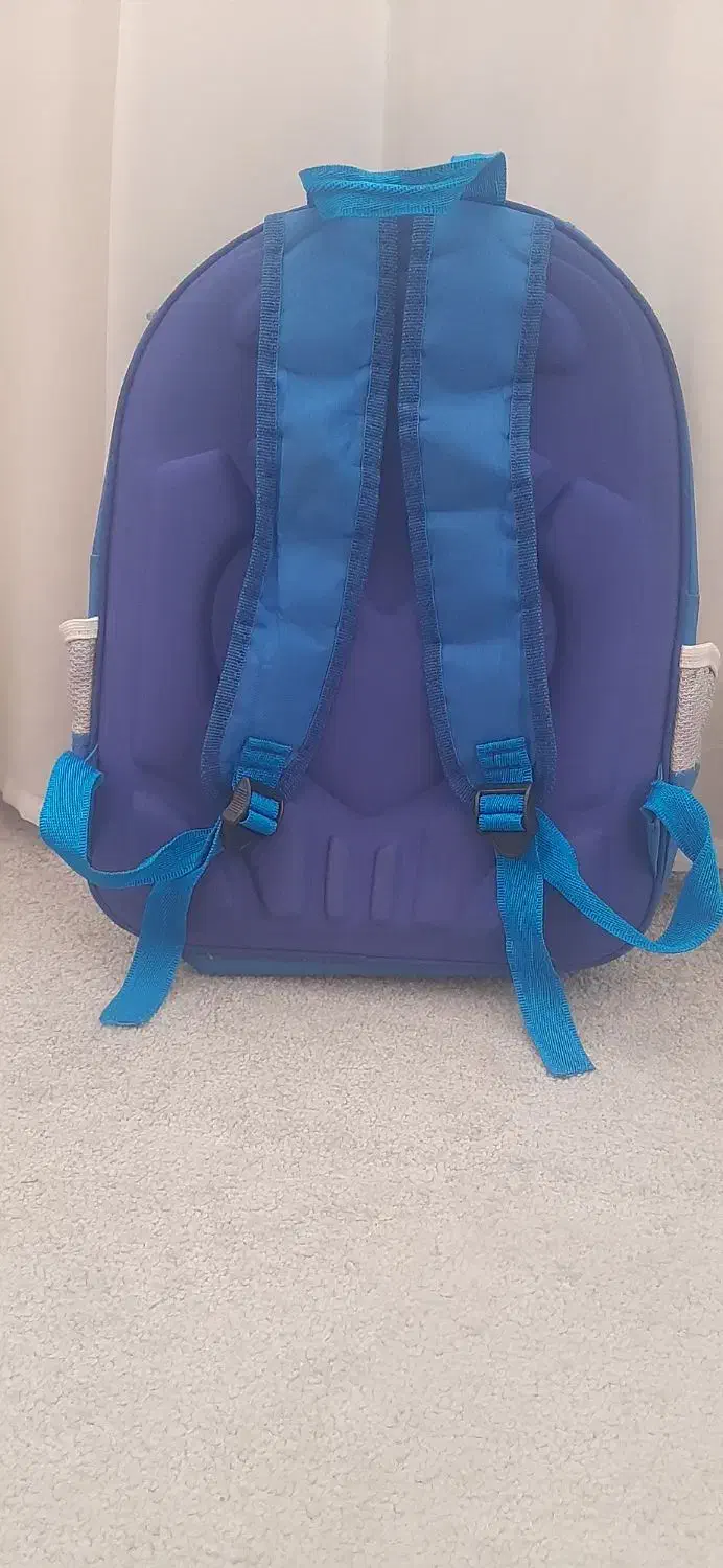 کوله مدرسه|کیف، کفش، کمربند|قم, بنیاد|دیوار