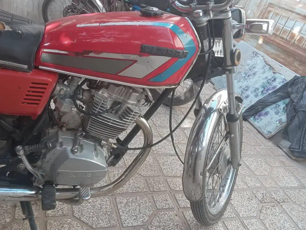 هندا احسان|موتورسیکلت|تربتحیدریه, مسجد جامع|دیوار