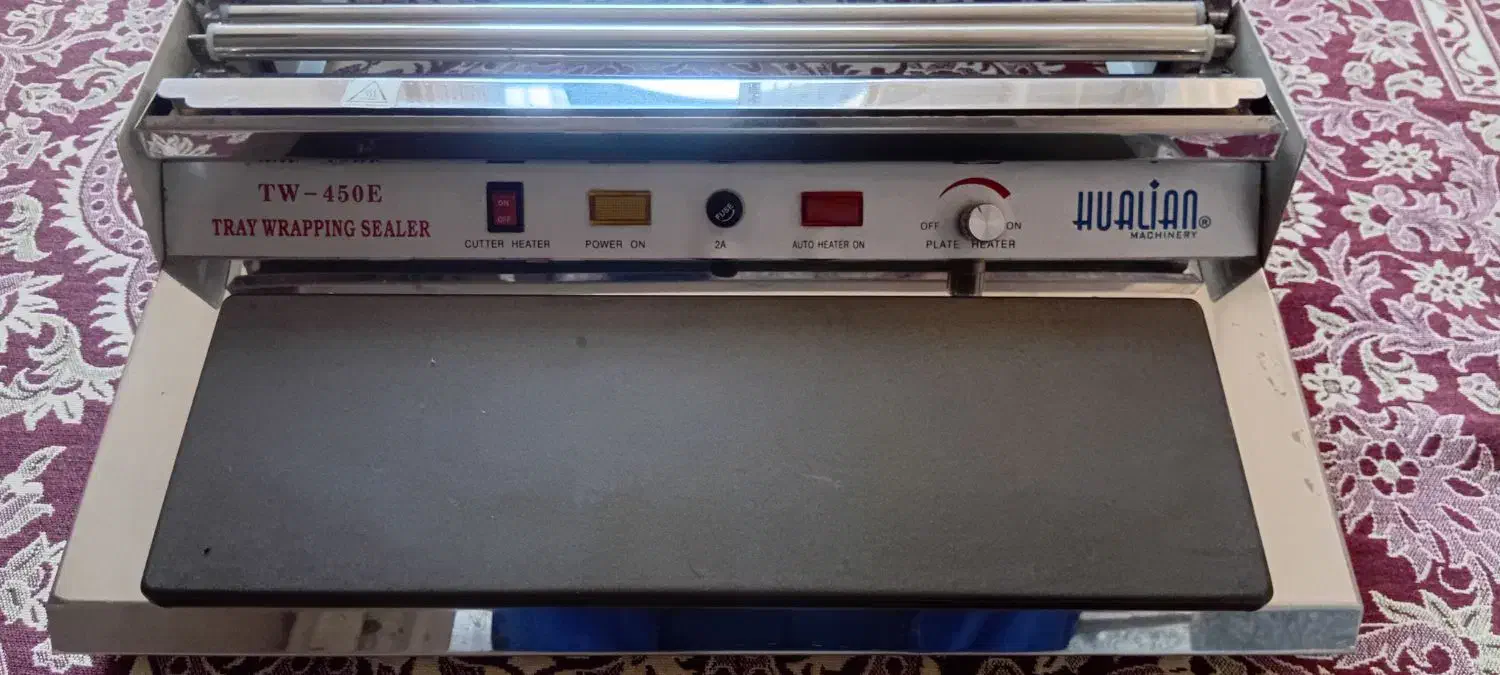 یک عدد دستگاه سلفون کش و یک عدد فن هواکش بزرگ|پنکه و تصفیهکنندهٔ هوا|تبریز, |دیوار