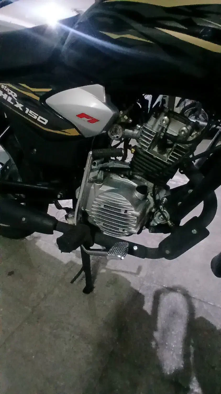 tvs hlx 1404|موتورسیکلت|ری, شهادت|دیوار