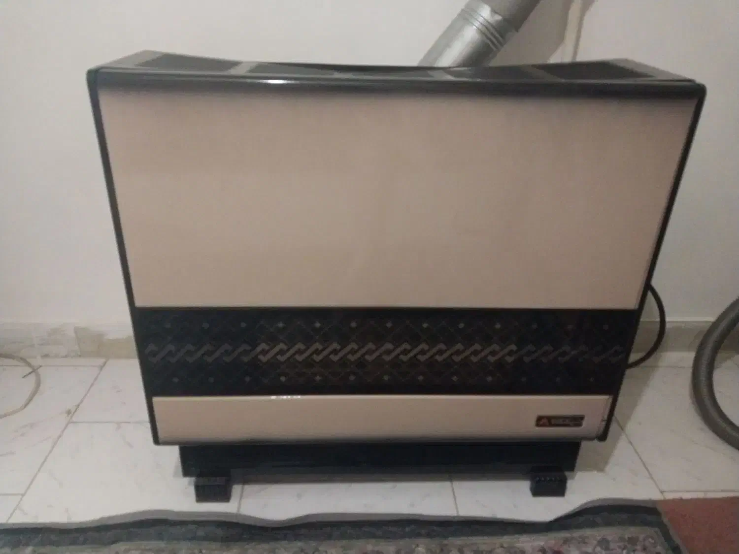 بخاری درحال استفاده سالم|بخاری، هیتر، شومینه|لاهیجان, کوی آزادگان|دیوار