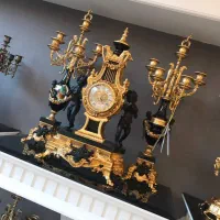 ساعت و شمعدان برنز